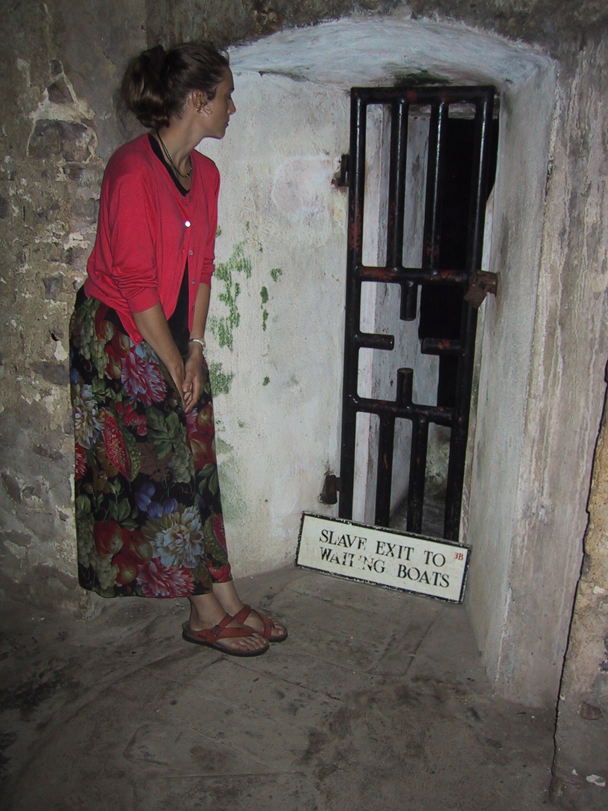 DeWolf family member Elizabeth Sturges Llerena at Elmina Castle in Ghana. This small passageway was captive Africans’ last exit before being boarded onto ships for the Middle Passage across the Atlantic.